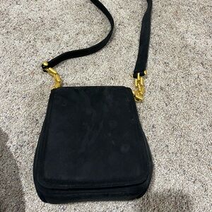 Elegant Black Crossbody Bag with Gold Hardware